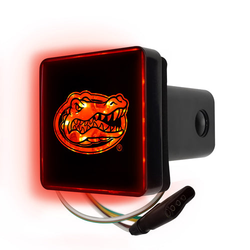 Lighted University of Florida hitch cover by Logo Brands attached to a vehicle trailer hitch.