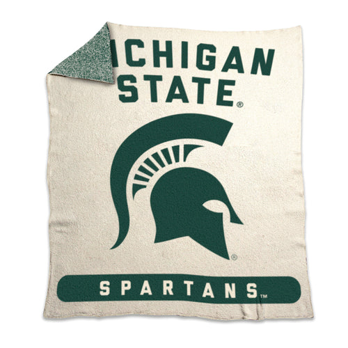 Michigan State Prime Luxe Dreams throw blanket by Logo Brands, featuring green and white Spartans logo and soft plush fabric.
