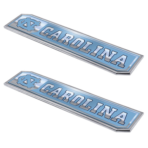Two UNC Chapel Hill embossed truck emblems by Logo Brands, featuring university logo and team colors for vehicle decoration.