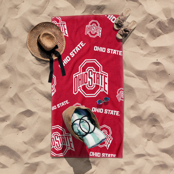 Ohio State beach towel with buckeye logo, 38x72 inches, featuring vibrant orange and black colors, ideal for beach or poolside use.