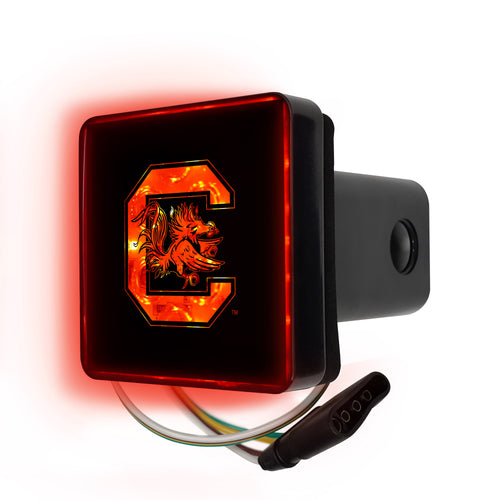 Lighted University of South Carolina hitch cover by Logo Brands attached to a vehicle's trailer hitch.