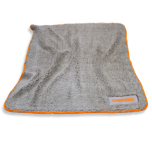 Tennessee Frosty Fleece blanket by Logo Brands, soft and cozy with a Tennessee-themed design, draped over a sofa.