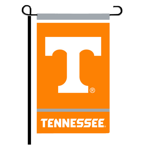 Tennessee garden flag measuring 12x18 inches with Tennessee state design, displayed outdoors in a garden setting.