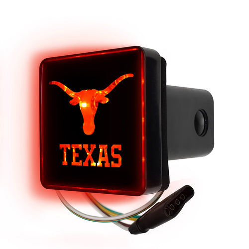 Lighted University of Texas hitch cover by Logo Brands attached to a vehicle hitch receiver.