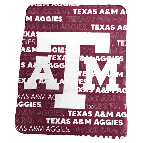 Texas A&M classic throw blanket by Logo Brands, featuring the team's logo and maroon and white colors, laid out on a surface.