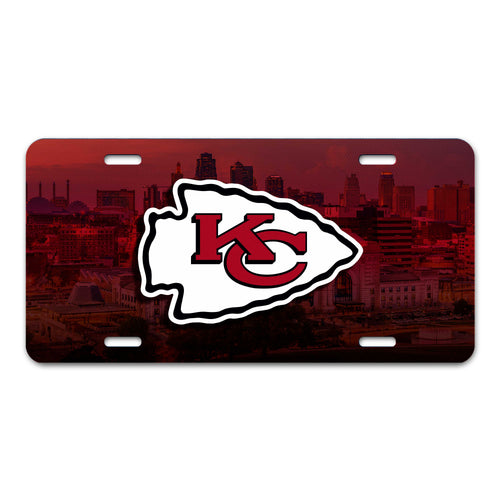 Kansas City Chiefs flat metal license plate featuring team logo and red background, ideal for car or home decor.