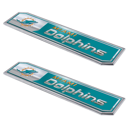 Two Miami Dolphins embossed truck emblems by Logo Brands, featuring team logo and detailed design, for vehicle decoration.