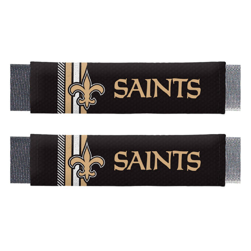 Pair of NFL New Orleans Saints rally seatbelt pads by Logo Brands attached to car seatbelts for comfort and team spirit.