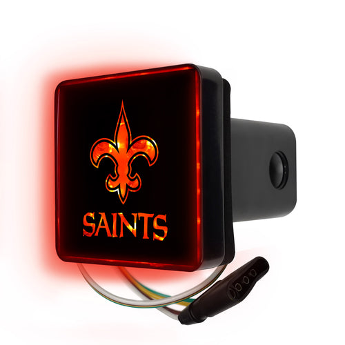 NFL New Orleans Saints lighted hitch cover by Logo Brands showing the Saints logo illuminated on a black hitch cover.