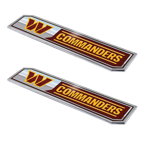 Two NFL Washington Commanders embossed truck emblems by Logo Brands shown in a close-up image.